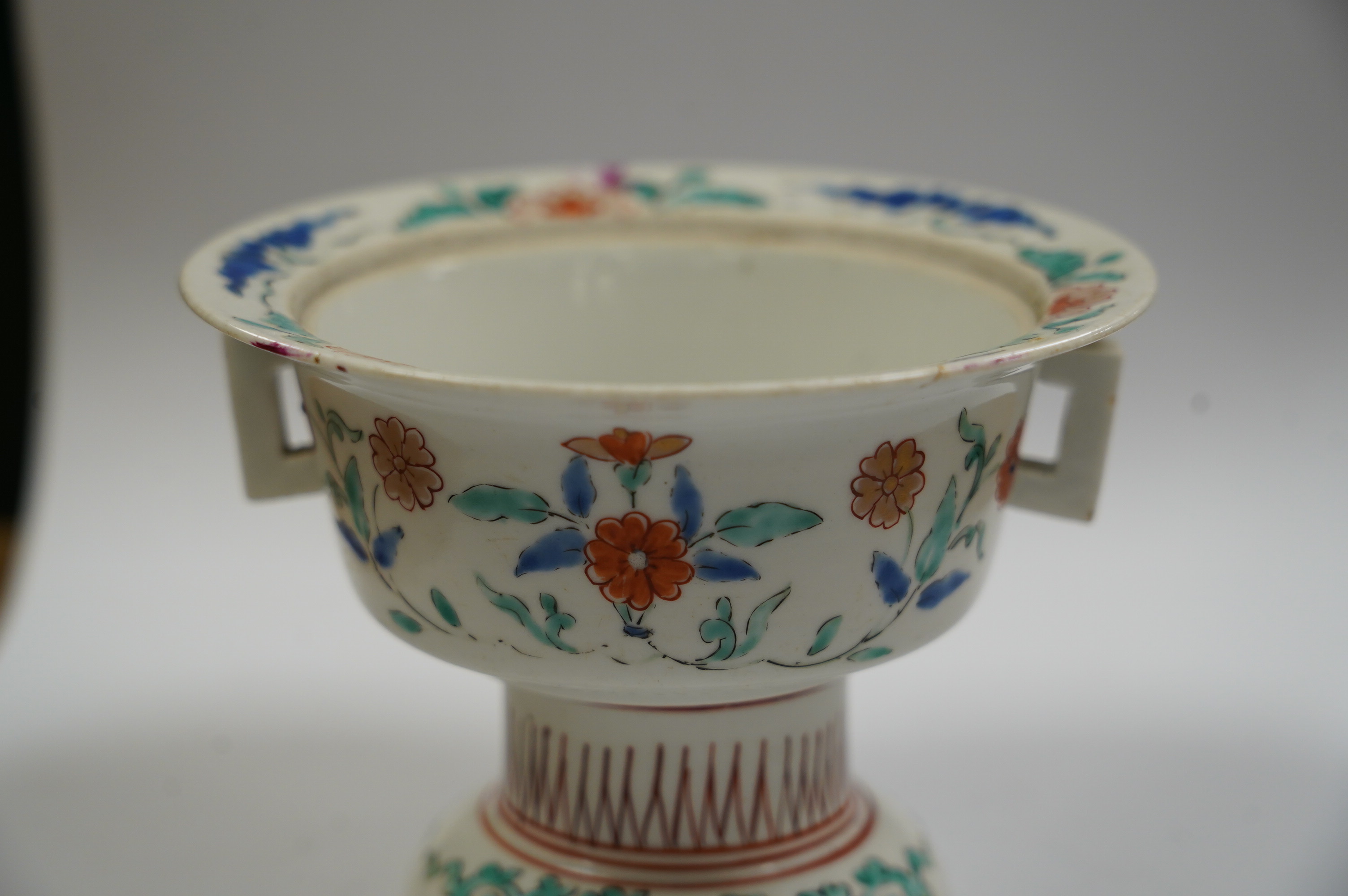 A Japanese Kakiemon stem bowl, lacking cover, late 17th century, 9cm. Condition - poor to fair